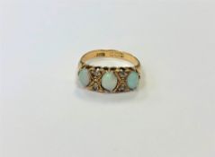 An antique 18ct gold opal and diamond ring,