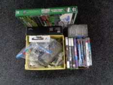 A box of Playstation 3 and Xbox 360 games, mobile phones,