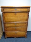 A late 19th century continental pine secretaire chest