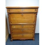 A late 19th century continental pine secretaire chest