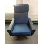 A mid 20th century Danish swivel chair on chrome case in blue fabric