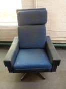 A mid 20th century Danish swivel chair on chrome case in blue fabric