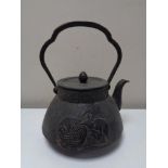 An antique Oriental style cast iron kettle with rat decoration