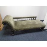 A Victorian ebonised chaise longue in green dralon