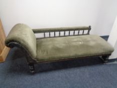 A Victorian ebonised chaise longue in green dralon