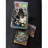 A box of lego and Star wars books