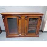 A Victorian mahogany glazed double door bookcase