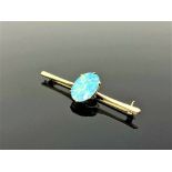 A yellow gold opal bar brooch