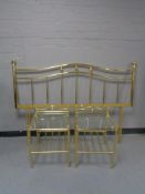 A brass 4'6 headboard and a pair of brass bedside stands