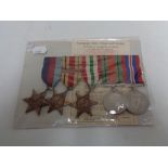 A set of five WW II medals on ribbons