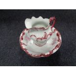 An antique floral wash jug and basin