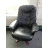 A black leather relaxer chair