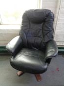 A black leather relaxer chair