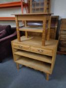 A blonde oak entertainment stand and a two tier coffee table