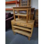 A blonde oak entertainment stand and a two tier coffee table