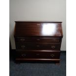 A 20th century mahogany bureau with brass drop handles