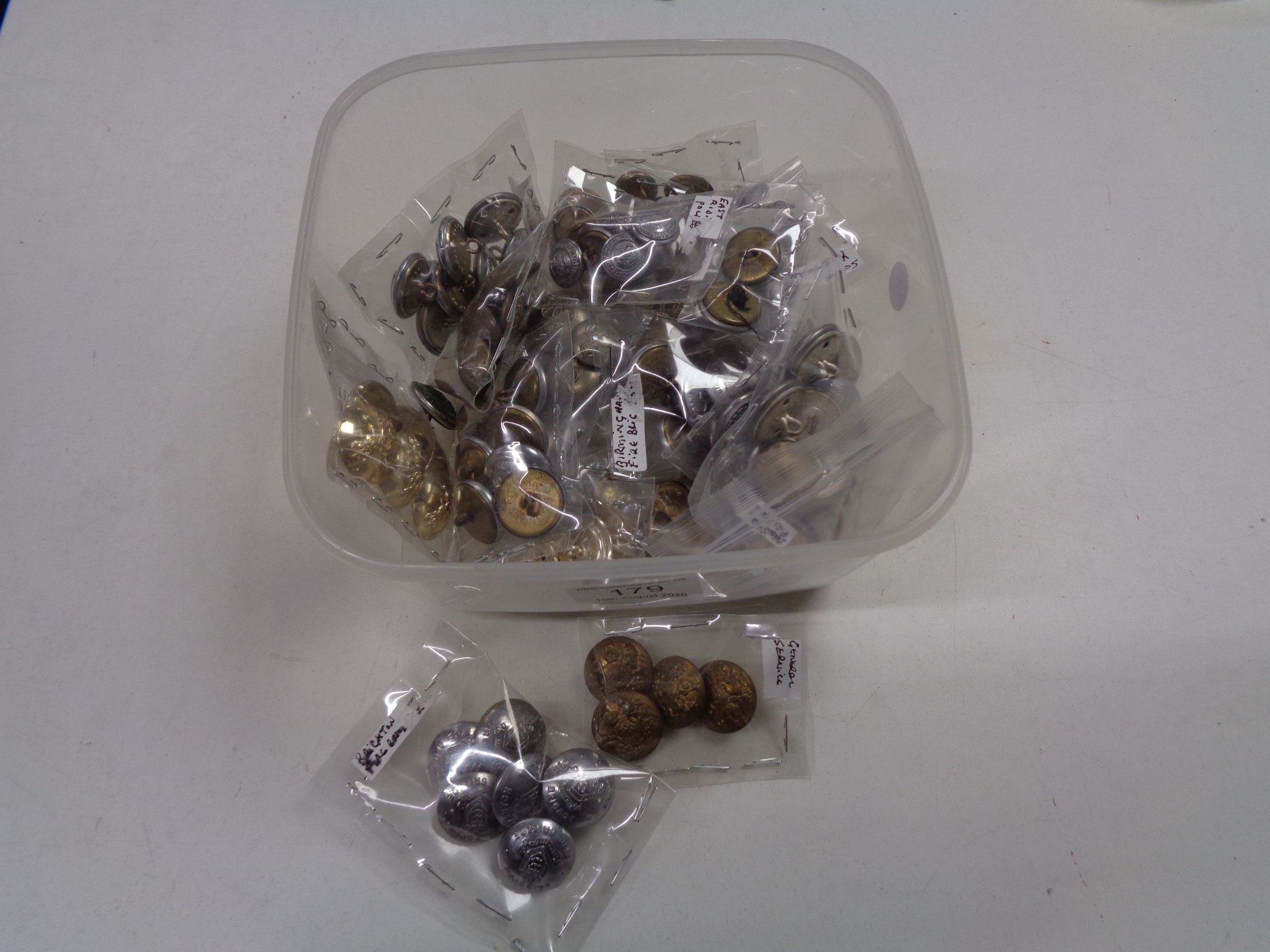 A box of military buttons