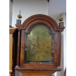 An antique oak and mahogany longcase clock by Burnett with pendulum and weights