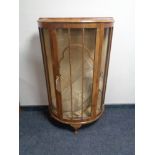 A 1930's walnut D-shaped display cabinet CONDITION REPORT: 75cm wide by 31cm deep