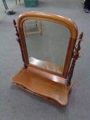 An antique mahogany dressing table mirror