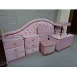 A six piece pink dralon bedroom set