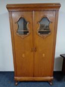 An early 20th century oak double door cabinet