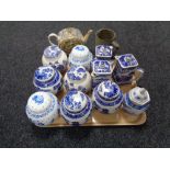 A tray of eleven Ringtons tea pots, lidded vases, ginger jars,