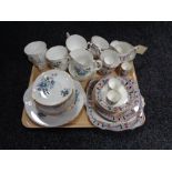 A tray of two tea services,