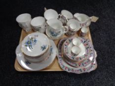 A tray of two tea services,