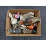 A box of wooden duck figures