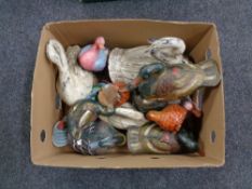 A box of wooden duck figures