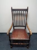 An Edwardian oak carver armchair