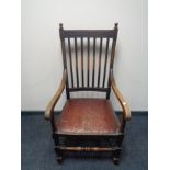 An Edwardian oak carver armchair