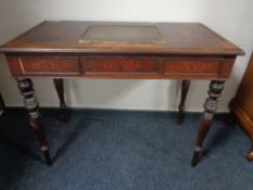 A late 19th century inlaid rosewood writing desk on turned legs