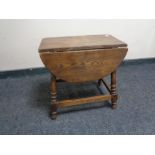 An oak drop leaf coffee table