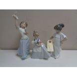 Three Nao figures - Girl with flowers no. 0495, girl in night dress no. 1110 and girl with dove.
