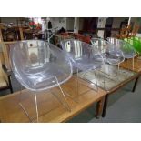 Four clear perspex Italian Pedrali ghost chairs on metal legs