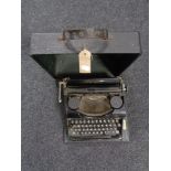 A cased vintage Simplex Olympia typewriter