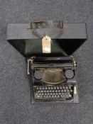 A cased vintage Simplex Olympia typewriter