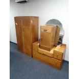 A three piece 1930's oak bedroom suite