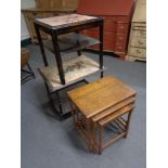 A nest of three oak barley twist occasional tables and two tiled topped coffee tables