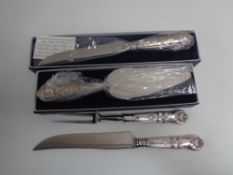 A boxed silver handled bread knife and cake slice,