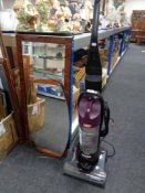 A Vax upright vac together with a mid century frameless mirror and one further hall mirror