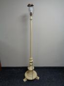 An antique painted standard lamp (continental wiring)