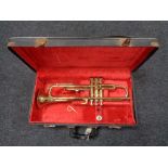 A brass Corton trumpet in fitted case
