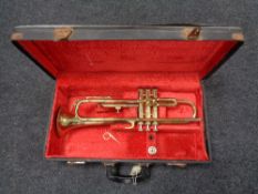 A brass Corton trumpet in fitted case