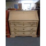 A 20th century blonde oak bureau