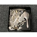 A box of various cutlery, coins, napkin ring, forks stamped '84', two shilling pieces,