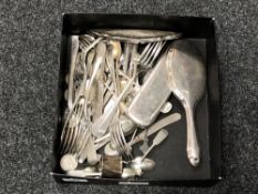 A box of various cutlery, coins, napkin ring, forks stamped '84', two shilling pieces,