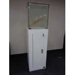 A square jeweller's shop display cabinet cupboards beneath, height 180 cm ,